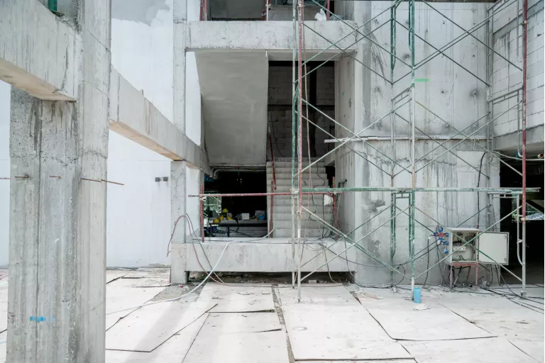 building site construction with cement wall and steel  frame constructure